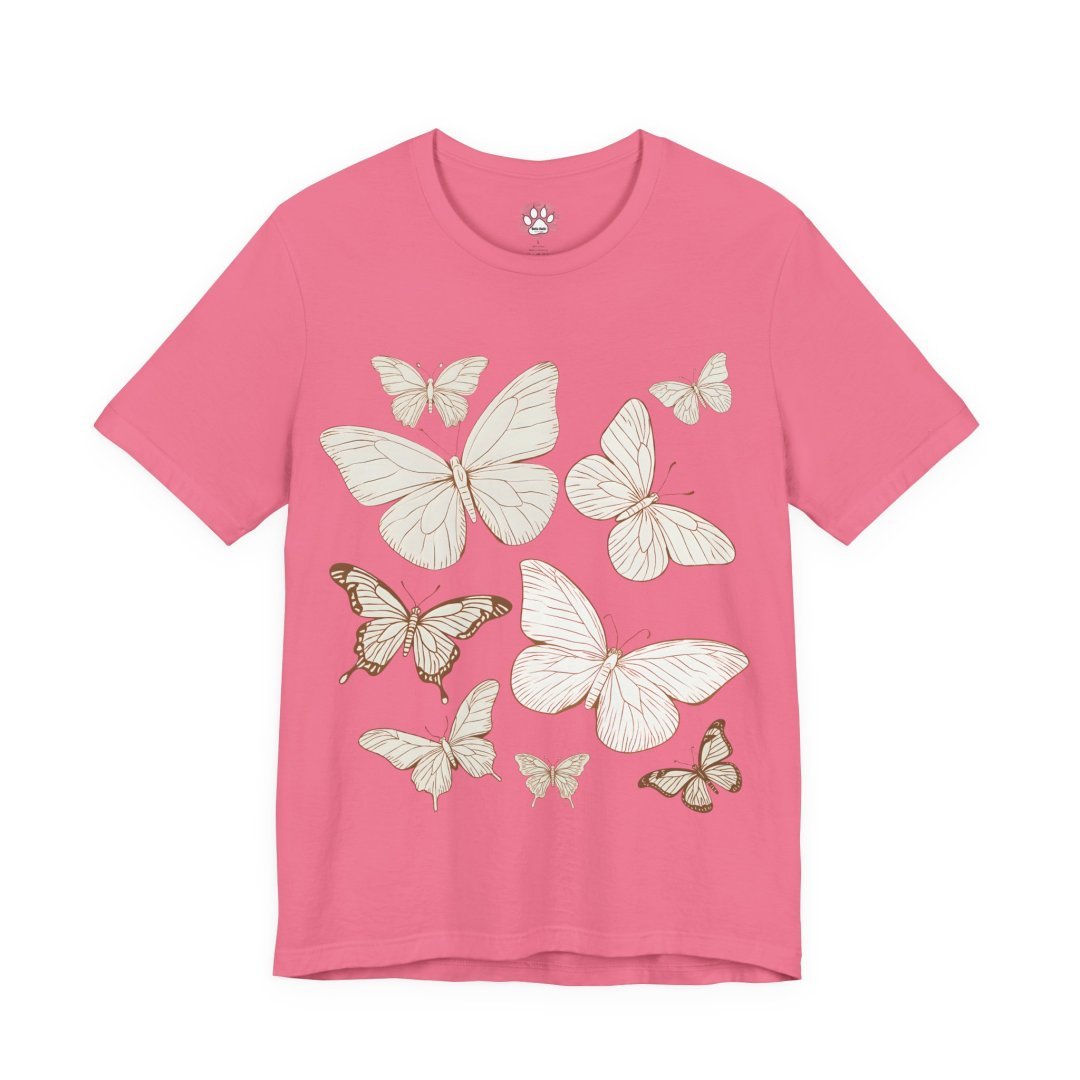 13260805213259904153_2048.jpeg Pink t-shirt with white and brown butterfly illustrations.
