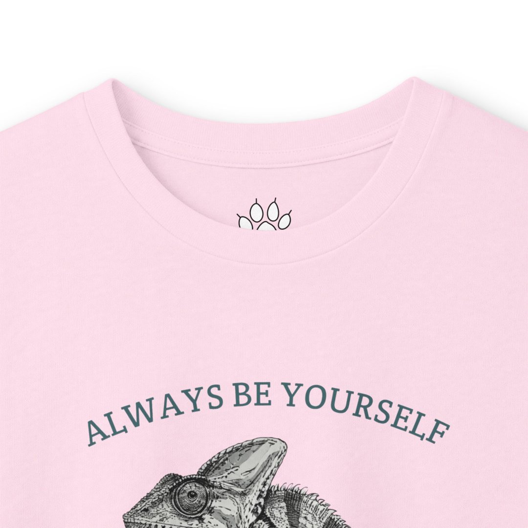 14110721768929830309_2048.jpeg Pink t-shirt with chameleon design and 'Always Be Yourself' text.