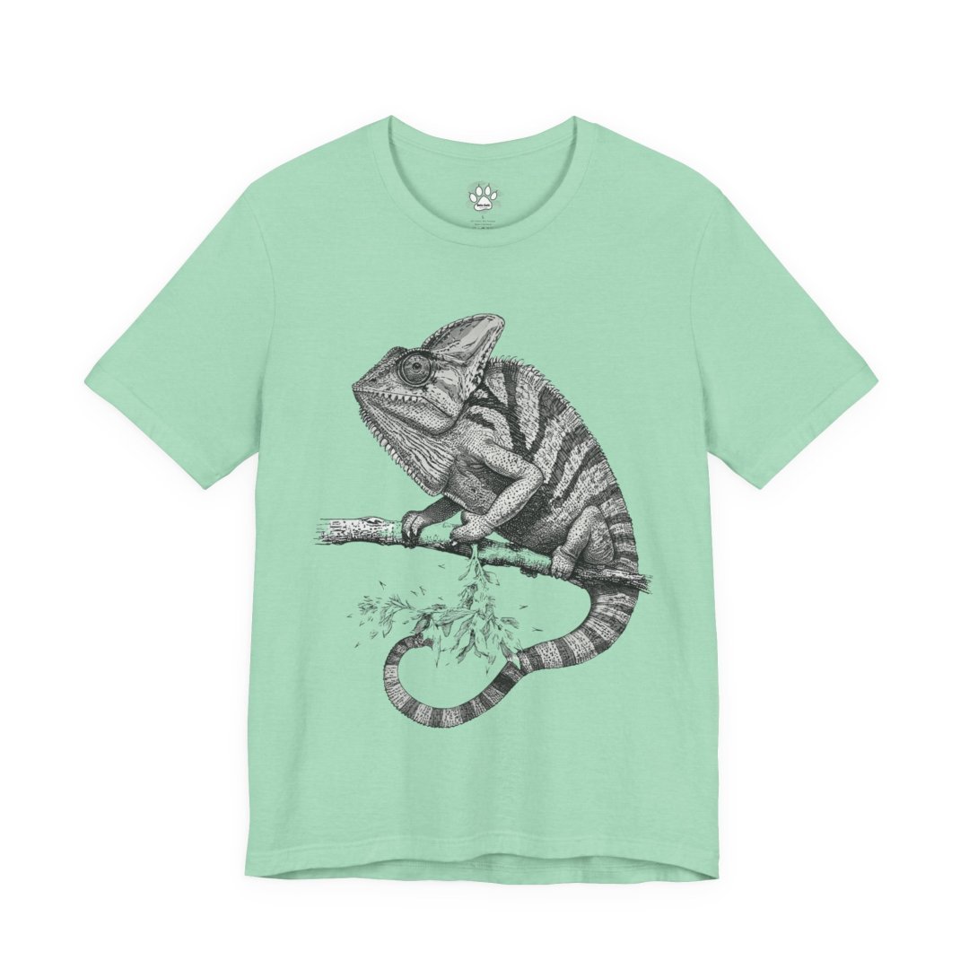14538221884090470346_2048.jpeg Mint green t-shirt with a detailed chameleon illustration.