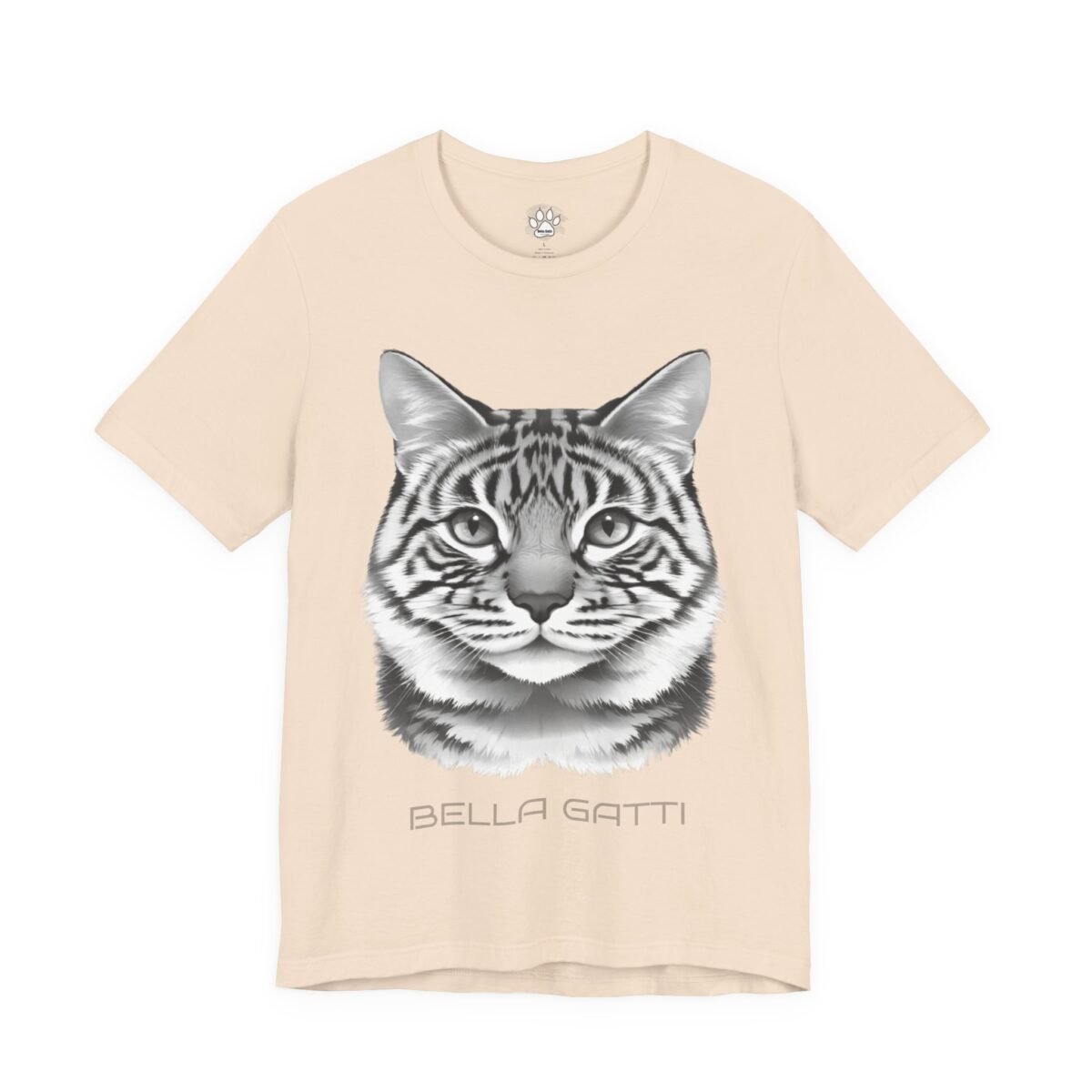 Bella Gatti Tabby Portrait Tee. Light beige t-shirt with a grayscale tiger-striped cat head and "BELLA GATTI" text.