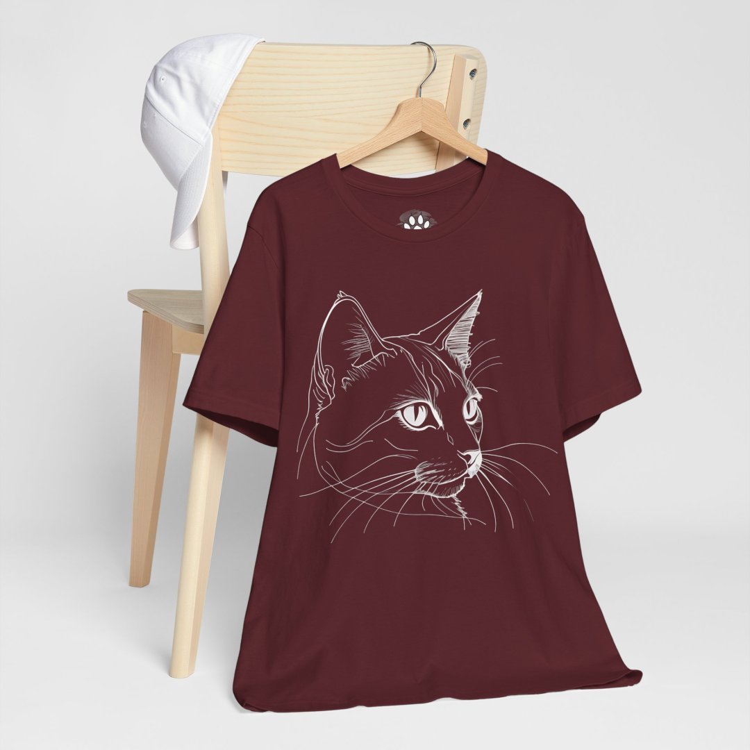 15207931386745091525_2048-1.jpeg Maroon t-shirt with white cat illustration on a chair.