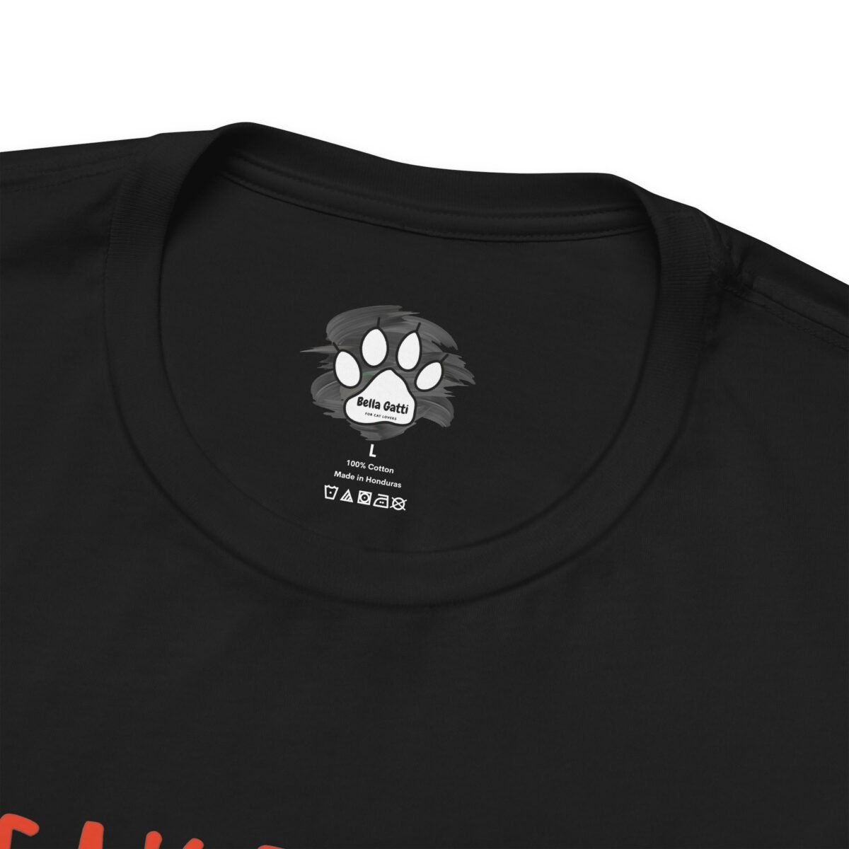 15482714598829899623_2048.jpeg Black t-shirt neck label with Bella Gatti cat paw print logo, size L, 100% Cotton, Made in Honduras.