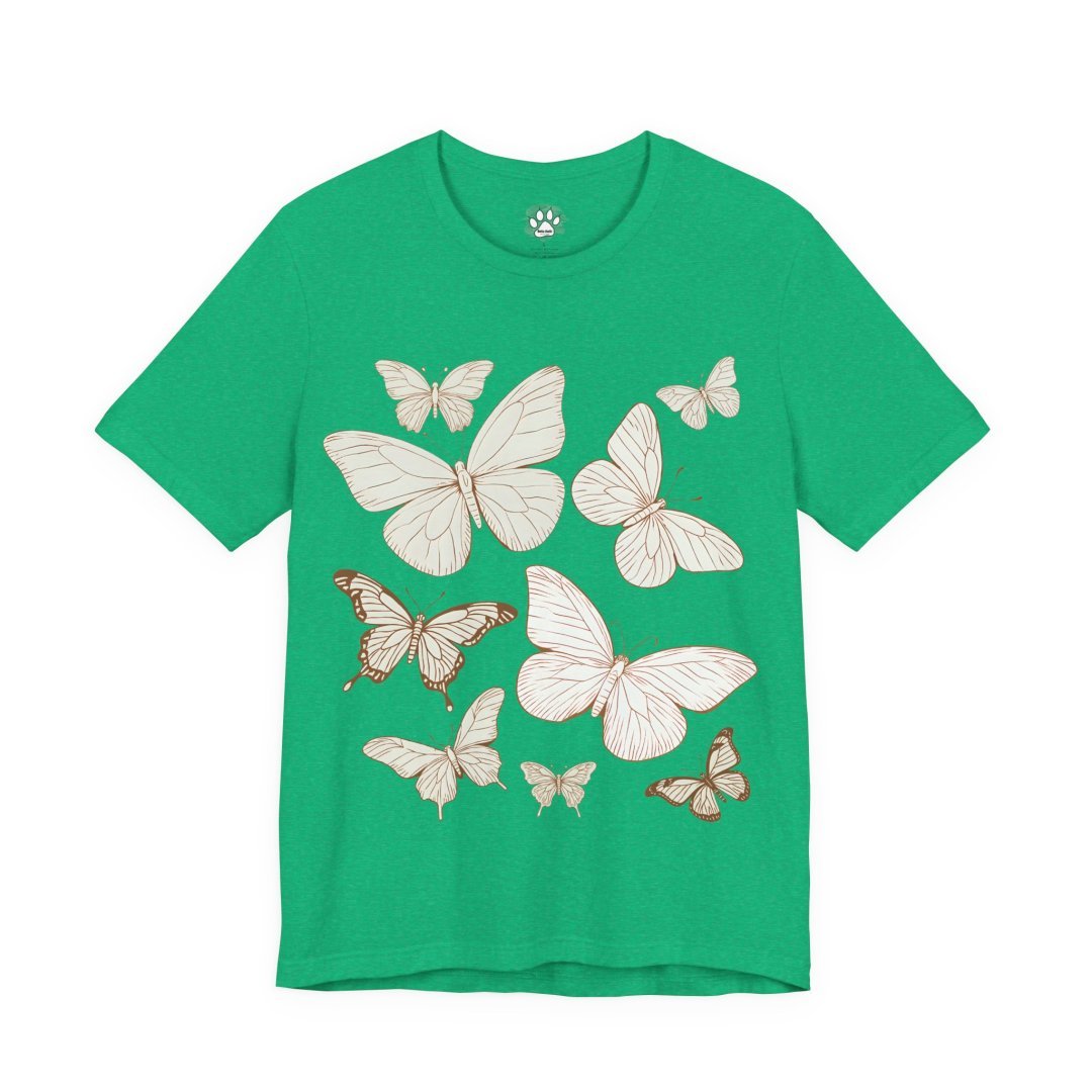 1551557560382187593_2048.jpeg Green t-shirt with a pattern of white and brown butterflies.