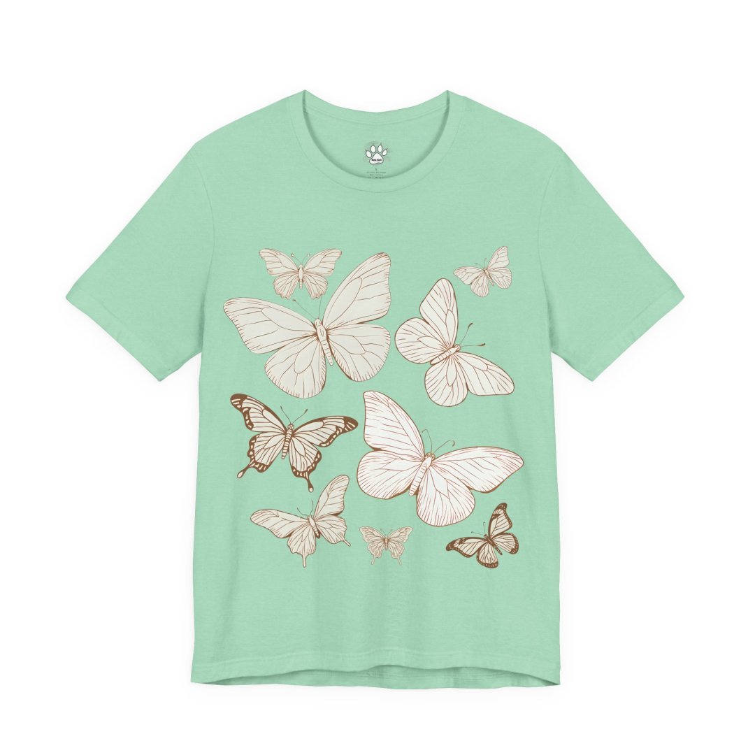 15522903923676877858_2048.jpeg Mint green t-shirt with a butterfly design.
