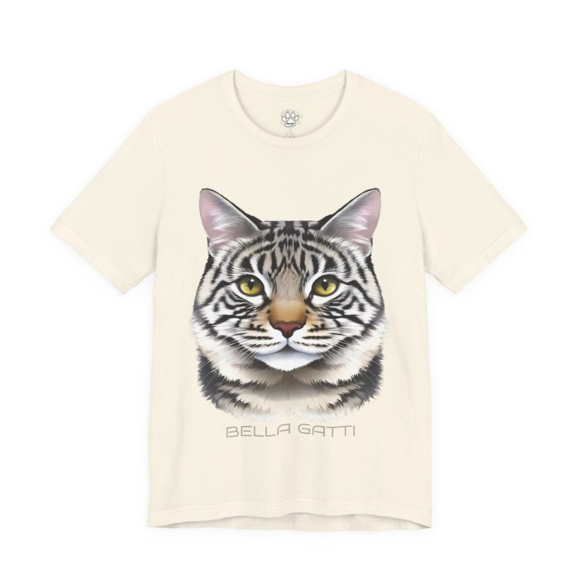 15548278485521764804_2048-3.jpeg Cream t-shirt featuring a striped cat's head with yellow eyes and "BELLA GATTI" text.