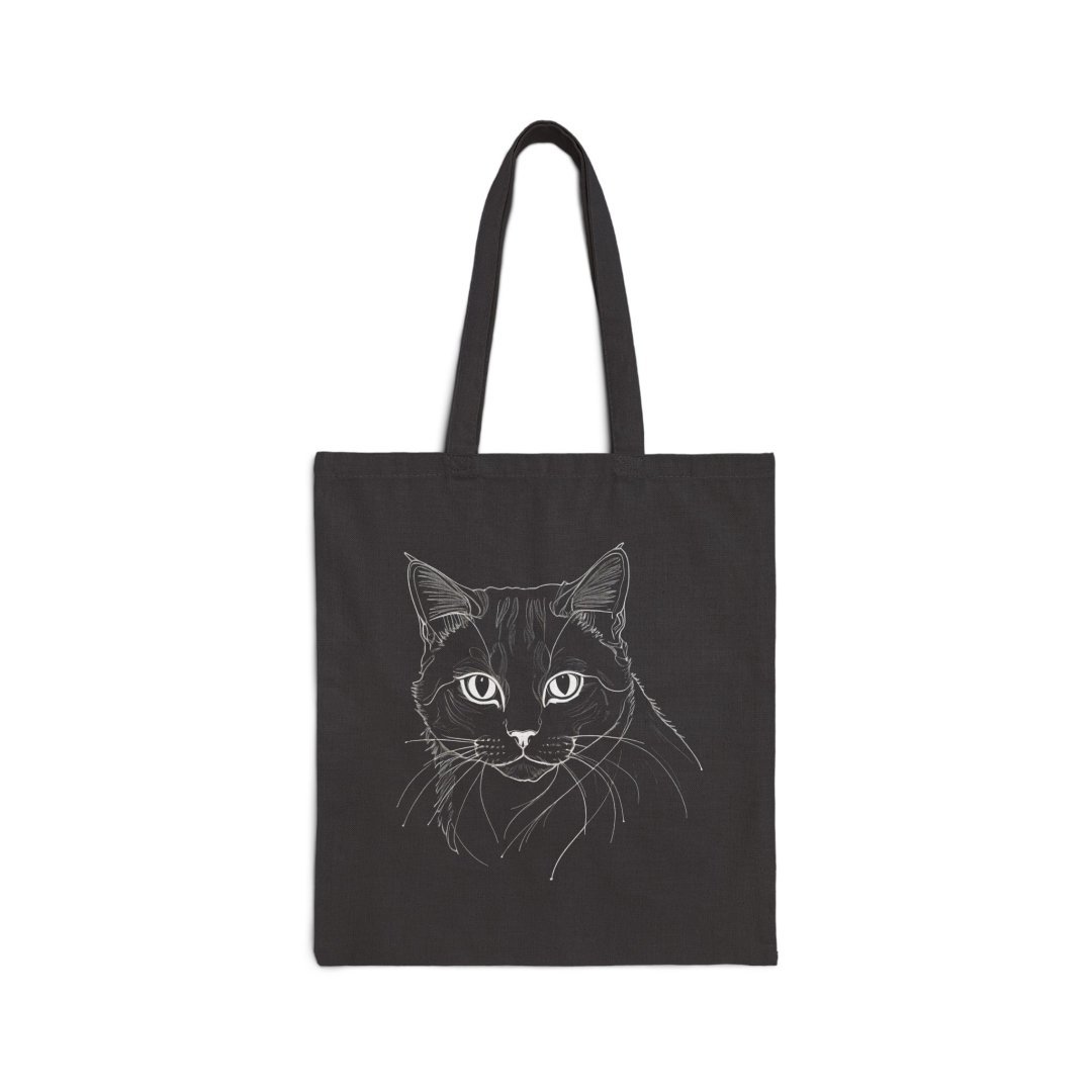 Cat Sketch Canvas Tote Bag. Black tote bag with a white line drawing of a cat's face.