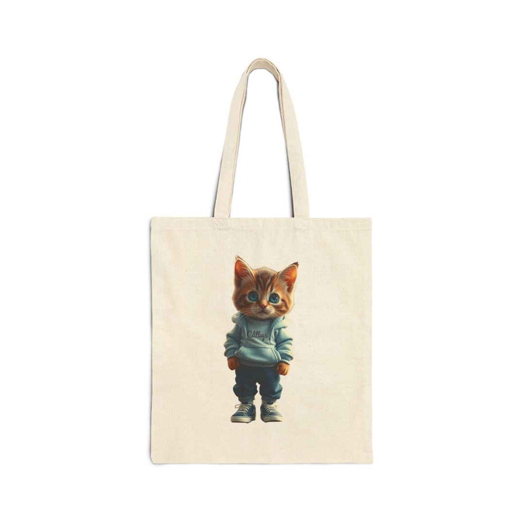 18330762999872697097_2048.jpeg Canvas tote bag with a cute cartoon cat in a hoodie.