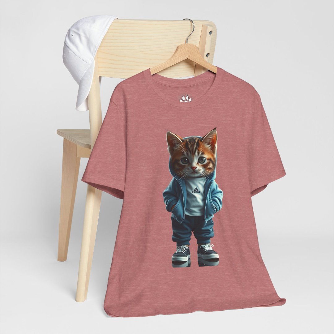2297434263326616443_2048.jpeg T-shirt with a cat in a blue jacket and sneakers, hanging on a chair.