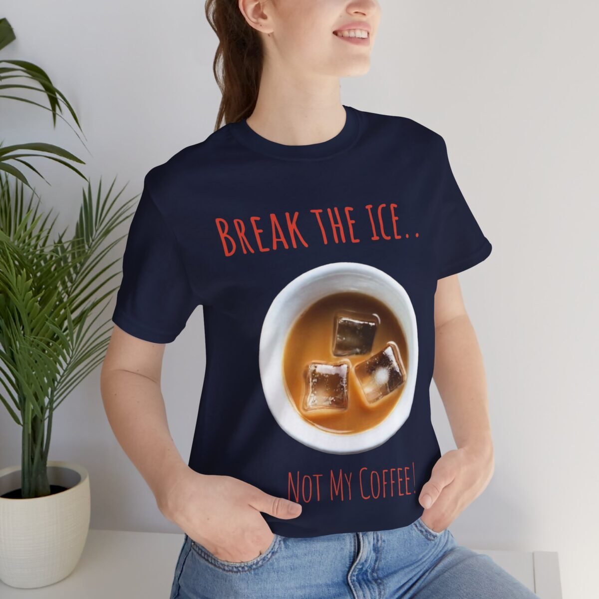 3058010483333884904_2048.jpeg Woman wearing a navy t-shirt with an iced coffee graphic and the text 'Break the ice.. Not my coffee!'.