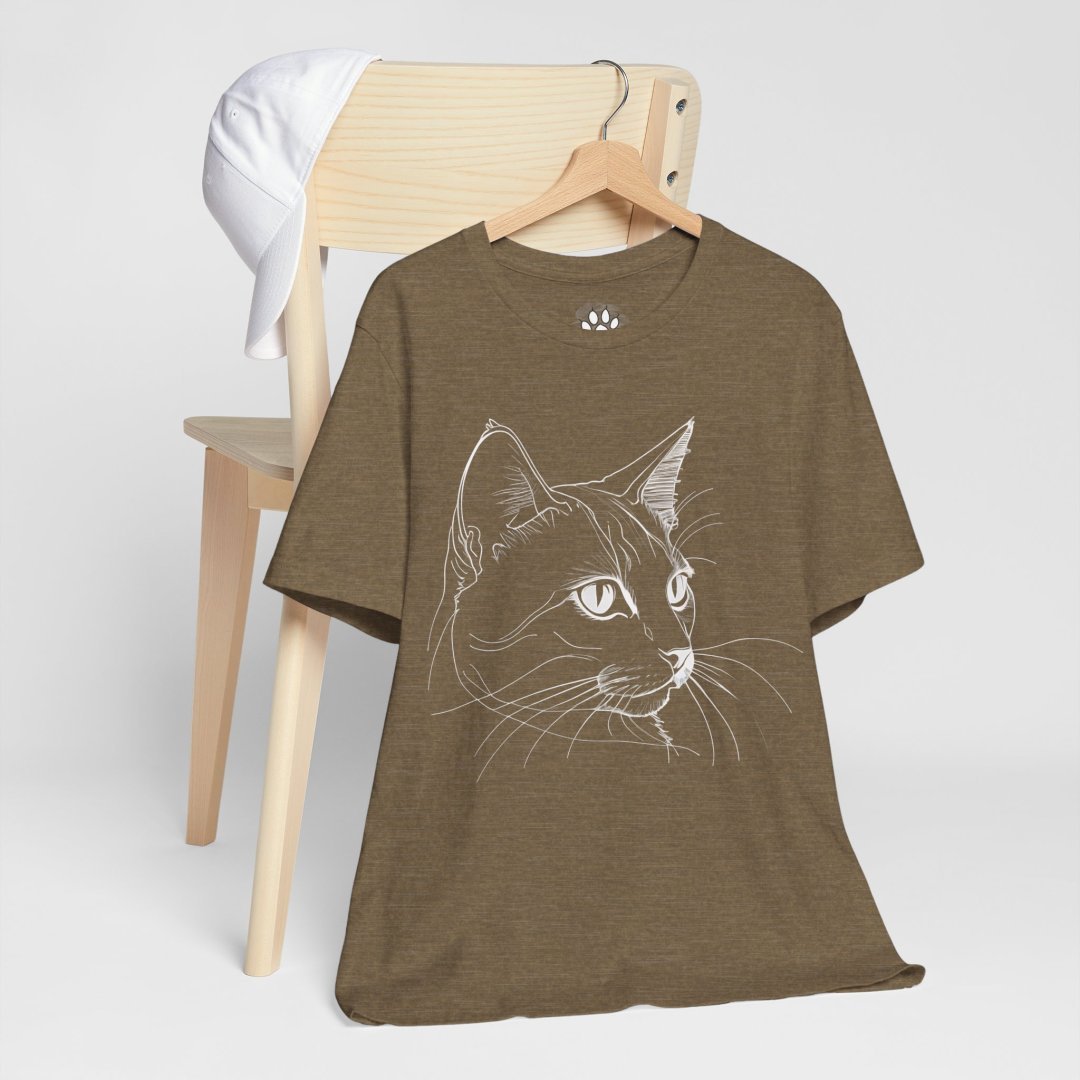 3452402375754558287_2048-1.jpeg Brown t-shirt with a white cat line drawing, hanging on a chair.