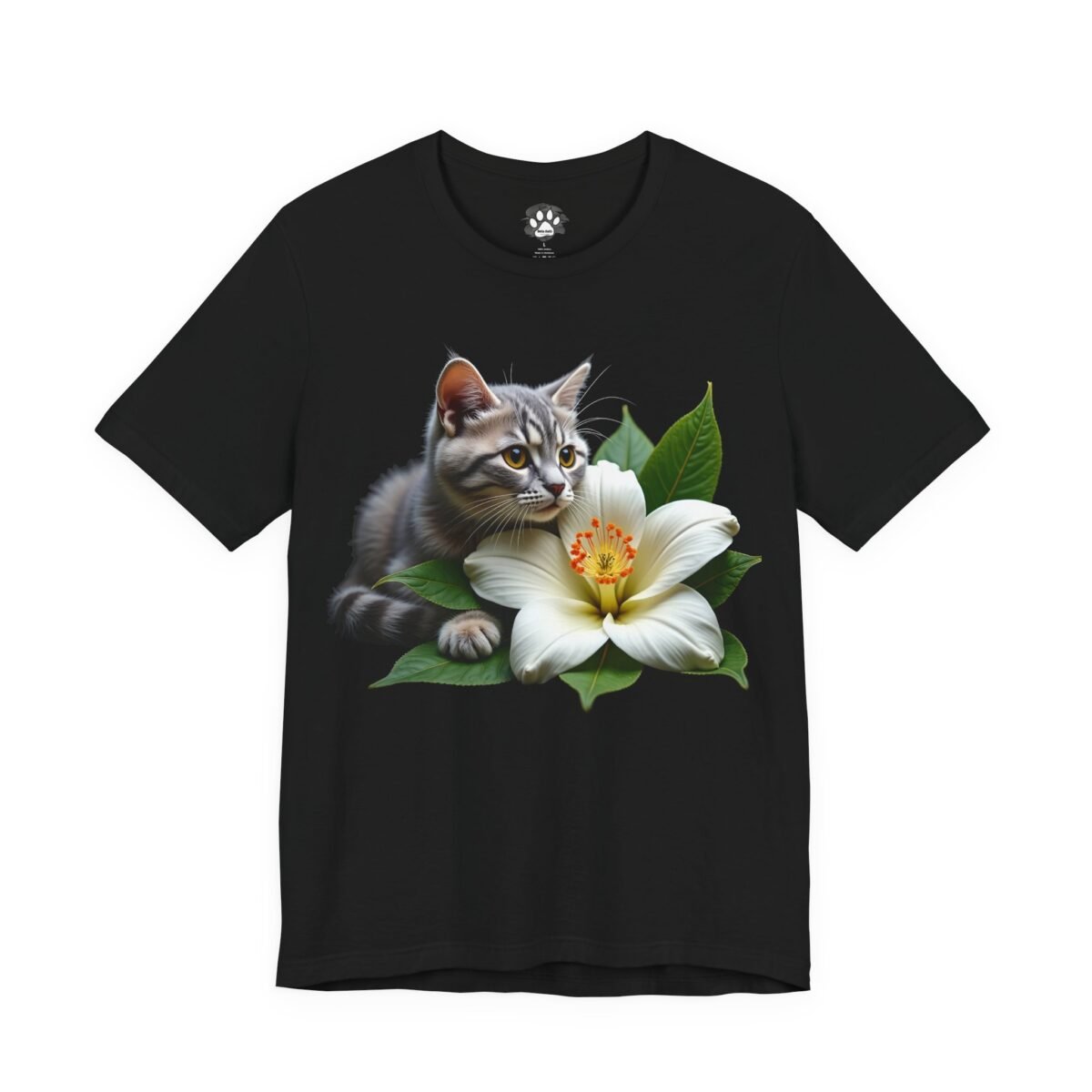 Whiskers & Magnolia Unisex Graphic Tee. Black t-shirt with a grey tabby kitten next to a white flower and green leaves.