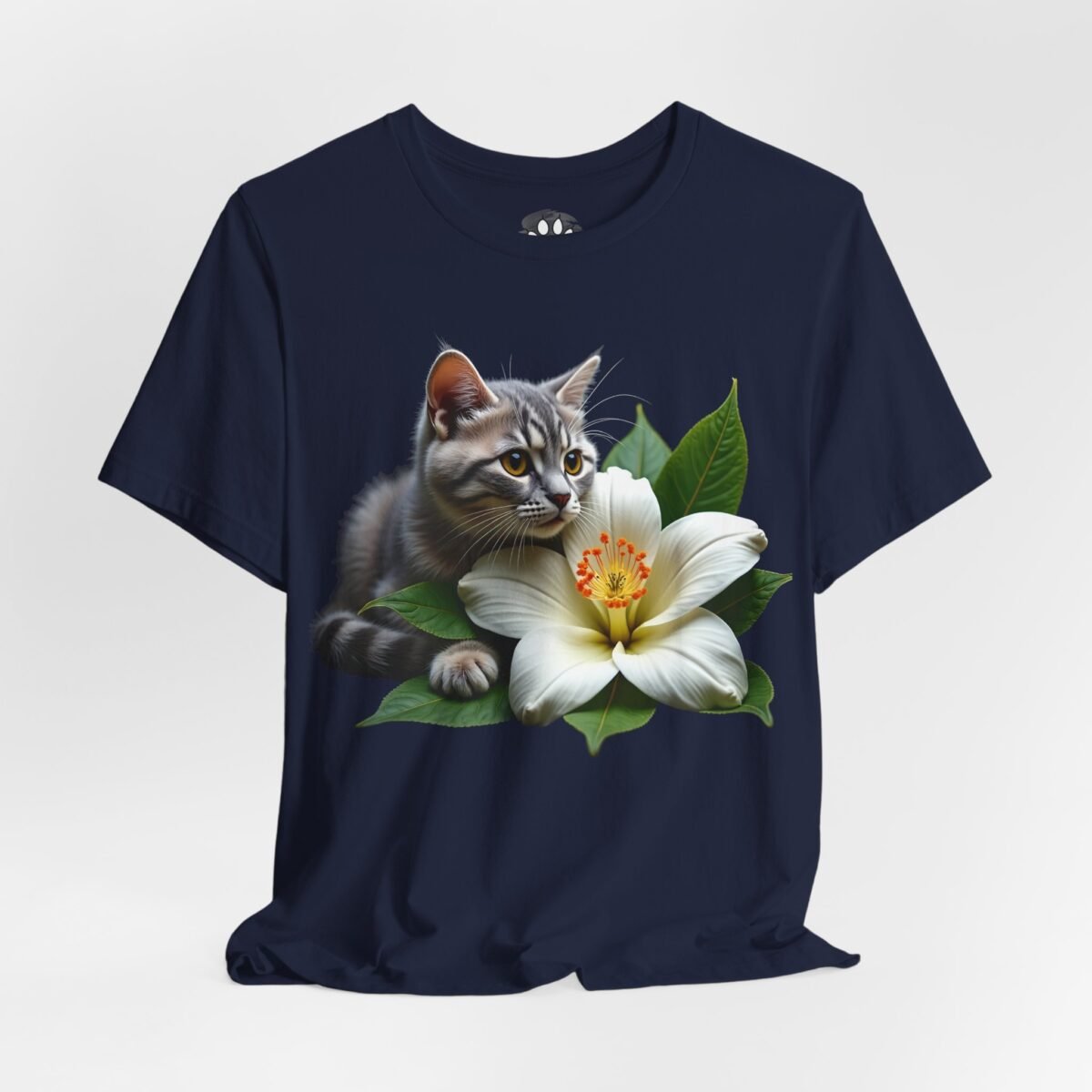 5705522963140031713_2048.jpeg Navy t-shirt with a gray kitten peeking from behind a large white flower.
