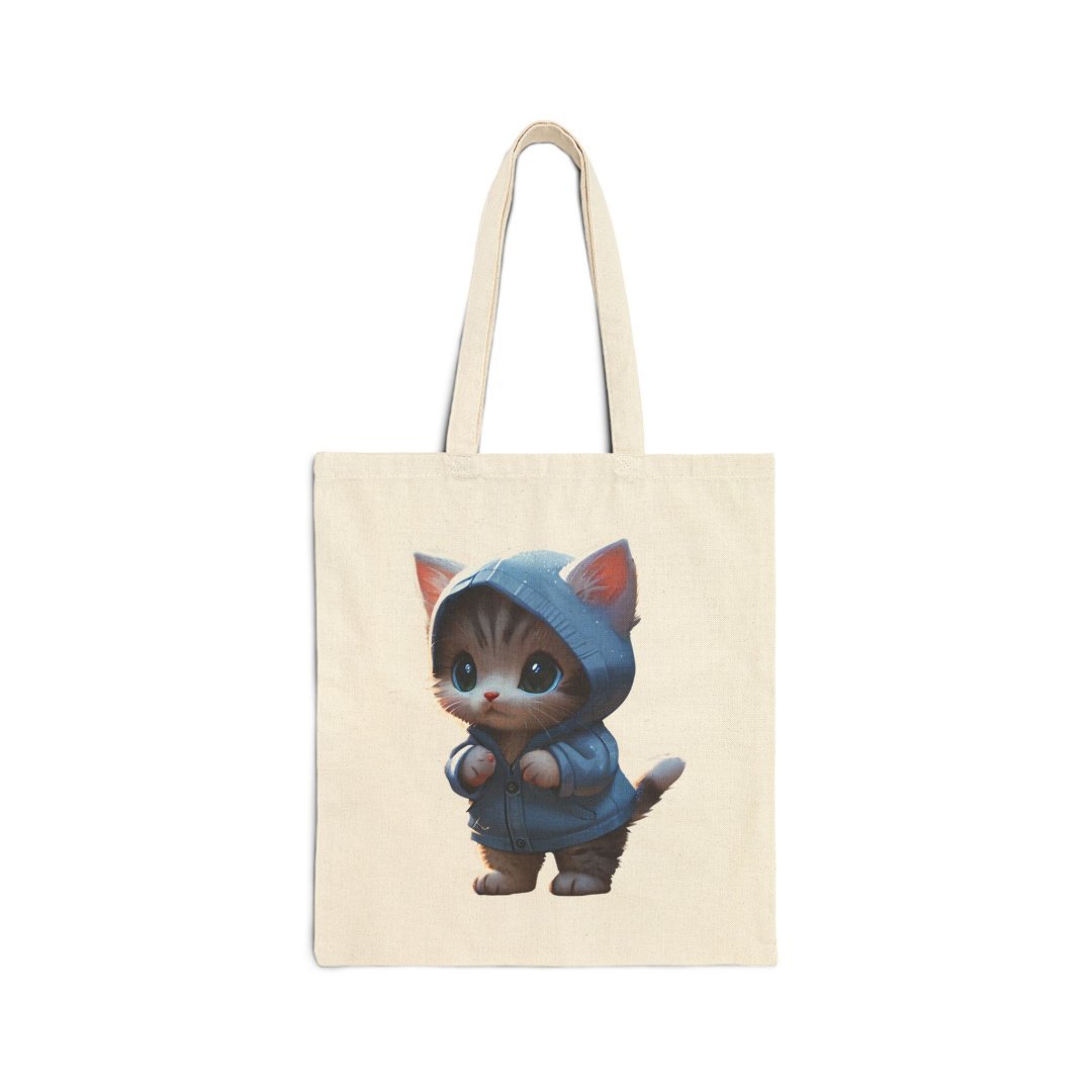 Hoodie Kitten Tote Bag. Cute kitten wearing a blue hoodie printed on a beige tote bag.