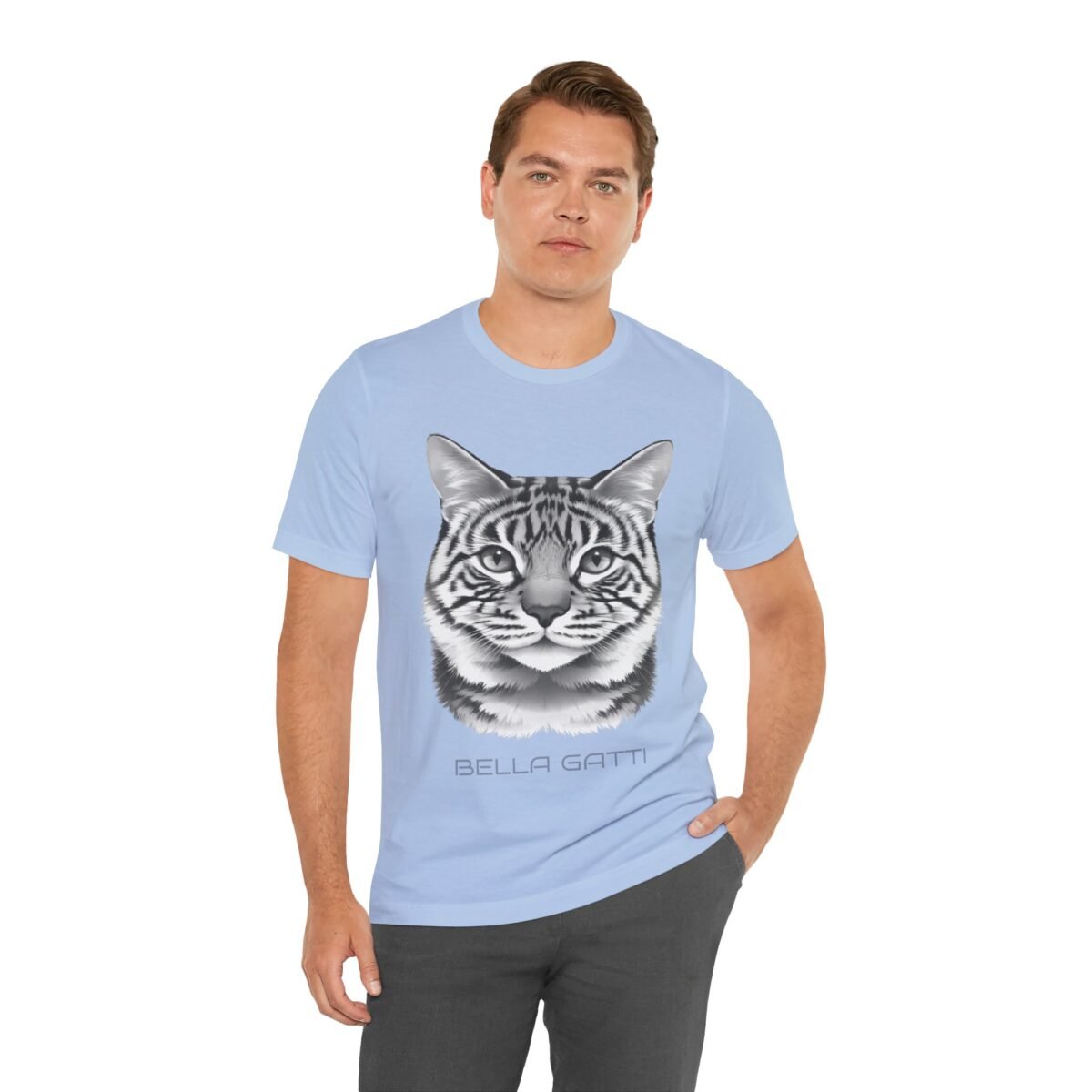 6831942066303748739_2048.jpeg Man wearing a light blue t-shirt with a black and white cat head graphic and "BELLA GATTI" text.