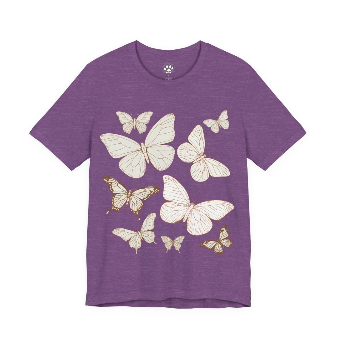 7551432805084377717_2048.jpeg Purple t-shirt with white and gold butterfly designs.