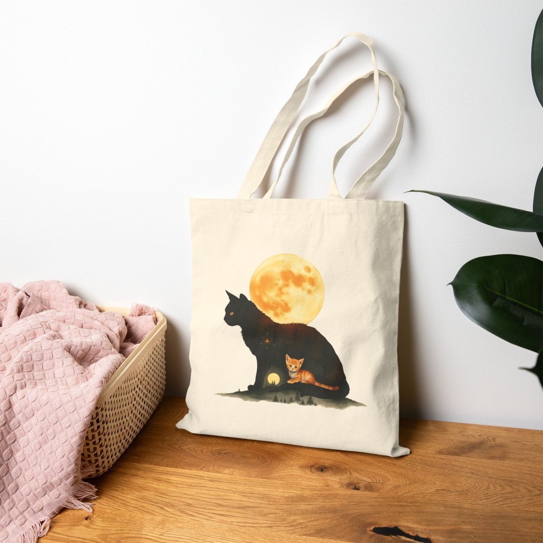 7965896225755641974_2048.jpeg Canvas tote bag with black cat and kitten design under a full moon.