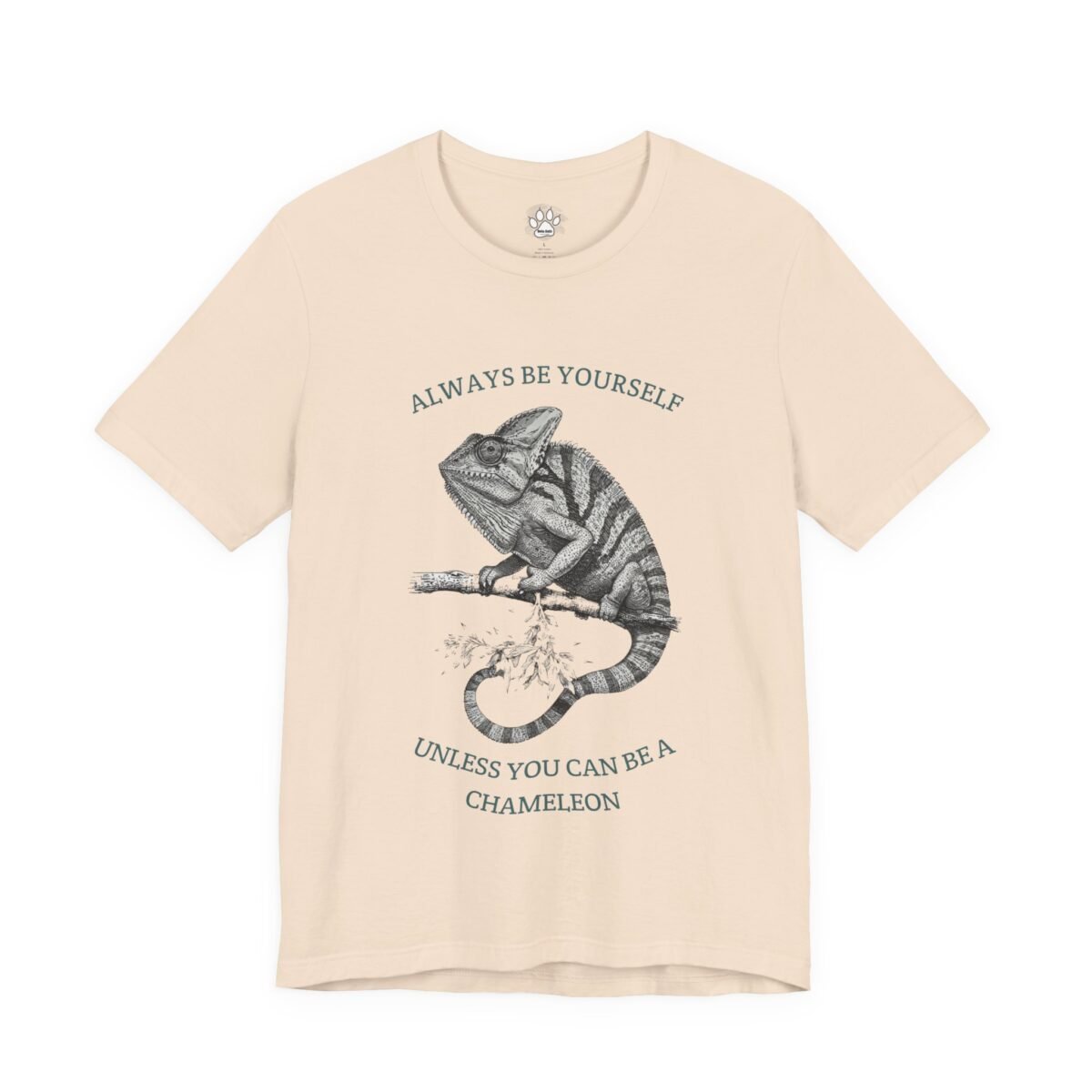 8711194562482676669_2048.jpeg Beige t-shirt with a chameleon illustration and the text "Always be yourself unless you can be a chameleon".