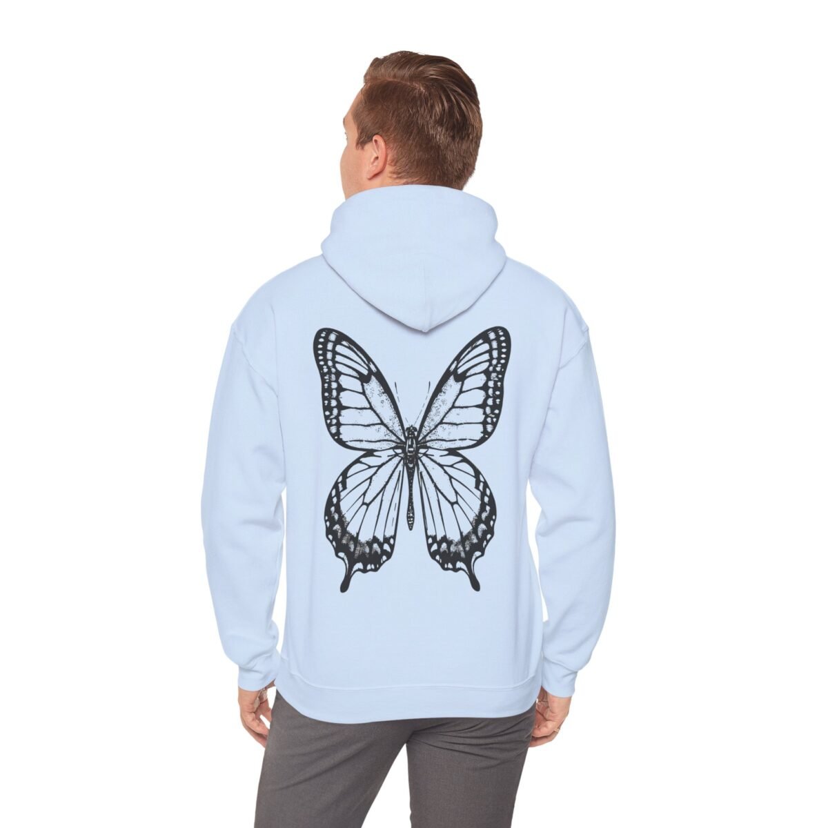 12346207027596412949_2048.jpeg Person from behind wearing a light blue hoodie with a large black butterfly design.