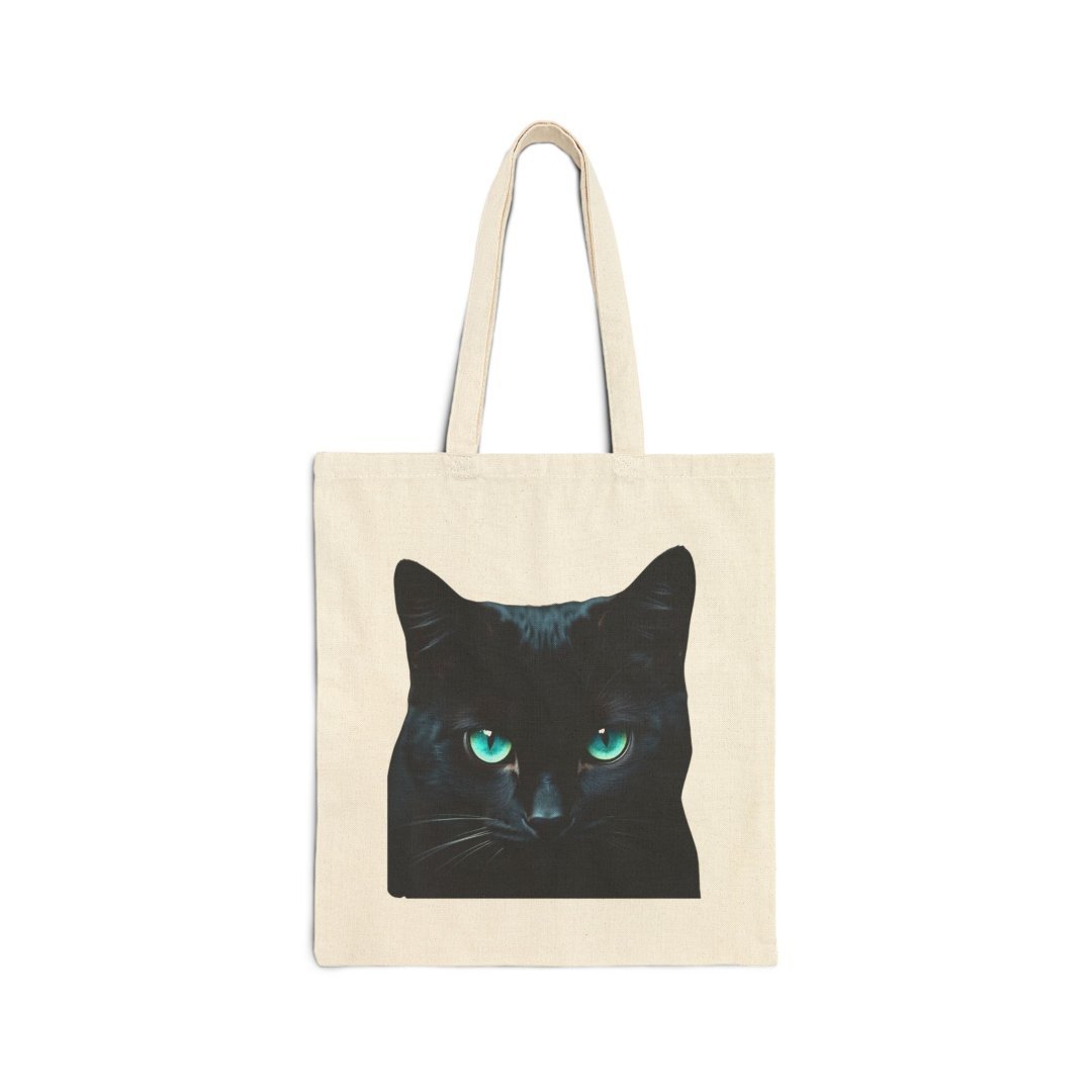 Black Cat Cotton Canvas Tote Bag. Canvas tote bag with a black cat design featuring striking green eyes.