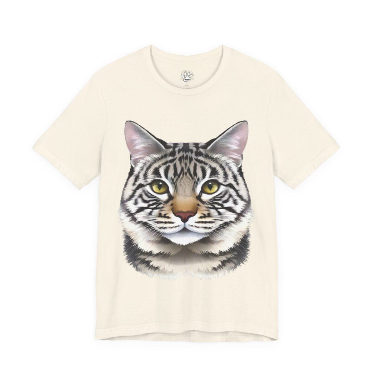 15612772283007787871_2048.jpeg Cream t-shirt with a detailed graphic of a striped cat face and yellow eyes.
