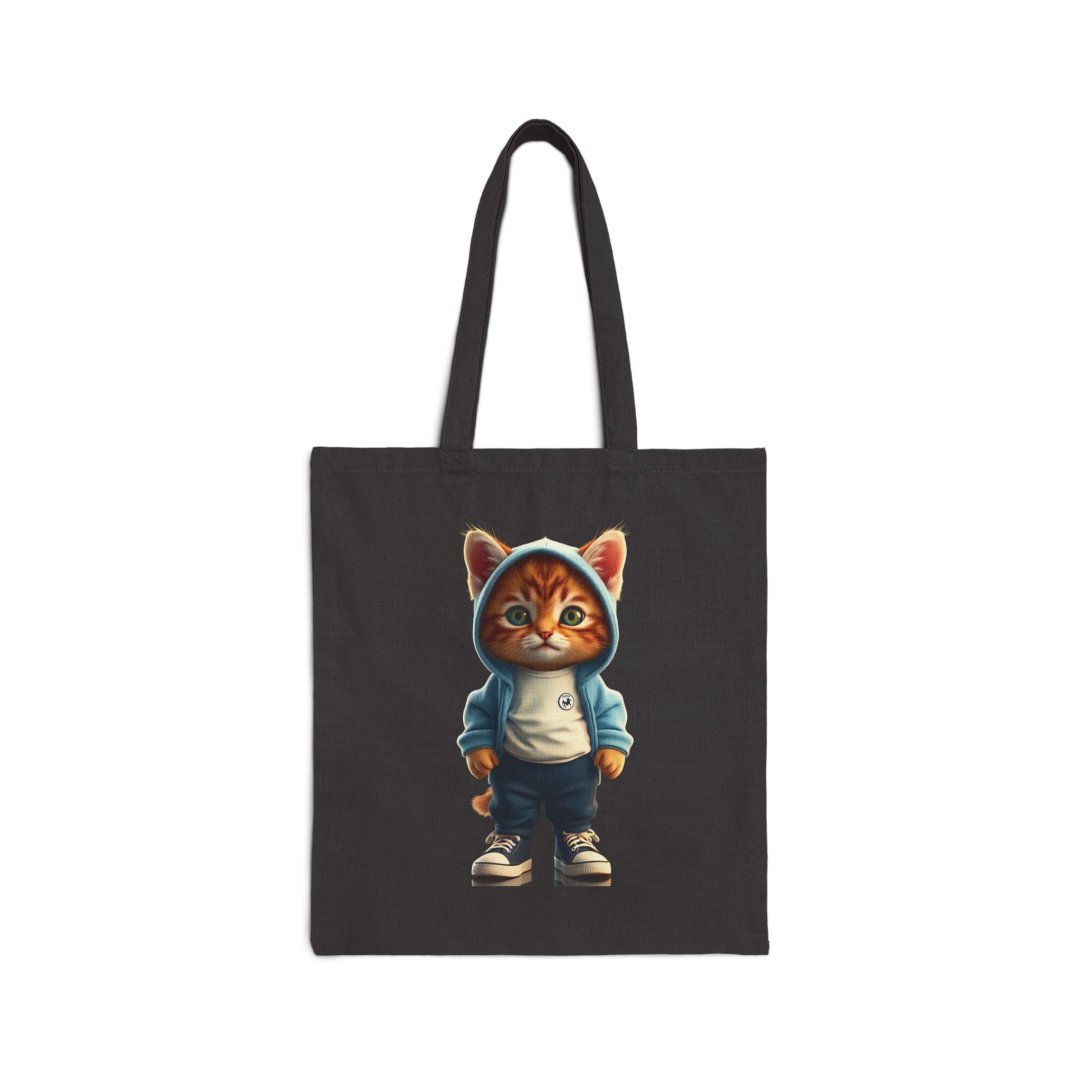 16607953802032899931_2048.jpeg Tote bag with a cute cat in a hoodie design.