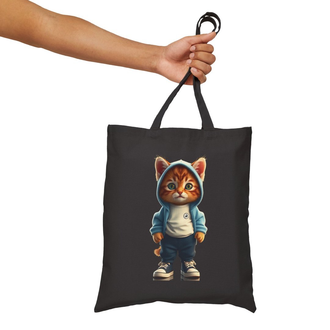 17887102265713395598_2048.jpeg Tote bag with a cute cat in a hoodie design.