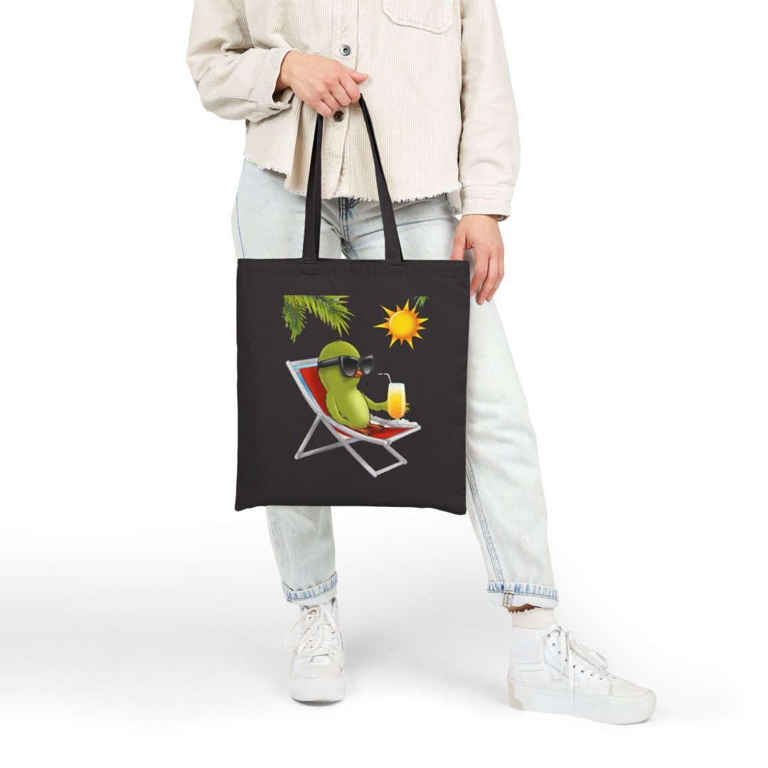 18114138849033520030_2048.jpeg Person holding a black tote bag with a cat relaxing on a beach chair design.
