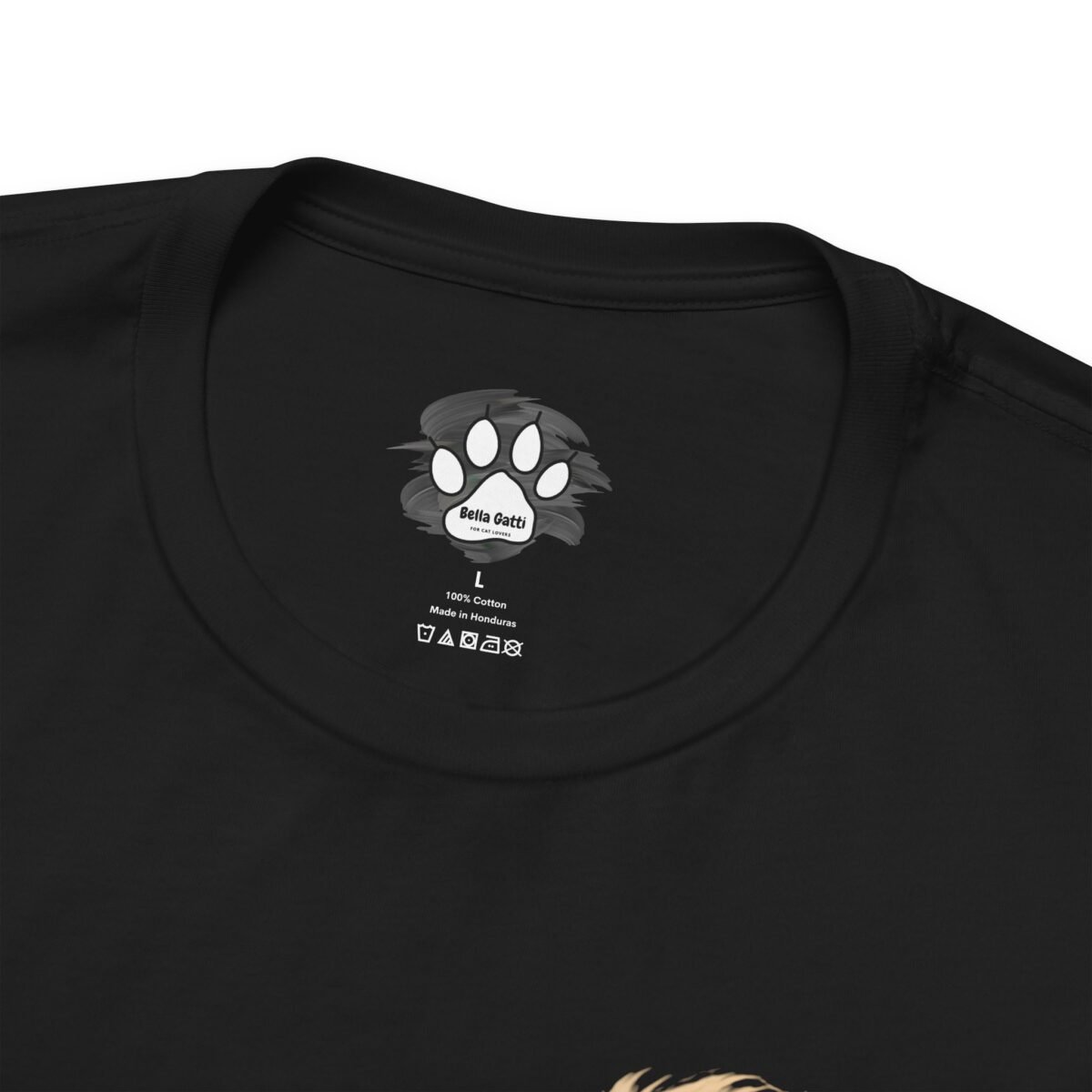 18248197220853874901_2048-1.jpeg Black t-shirt with a white Bella Gatti paw print logo and label text: size L, 100% Cotton, Made in Honduras.