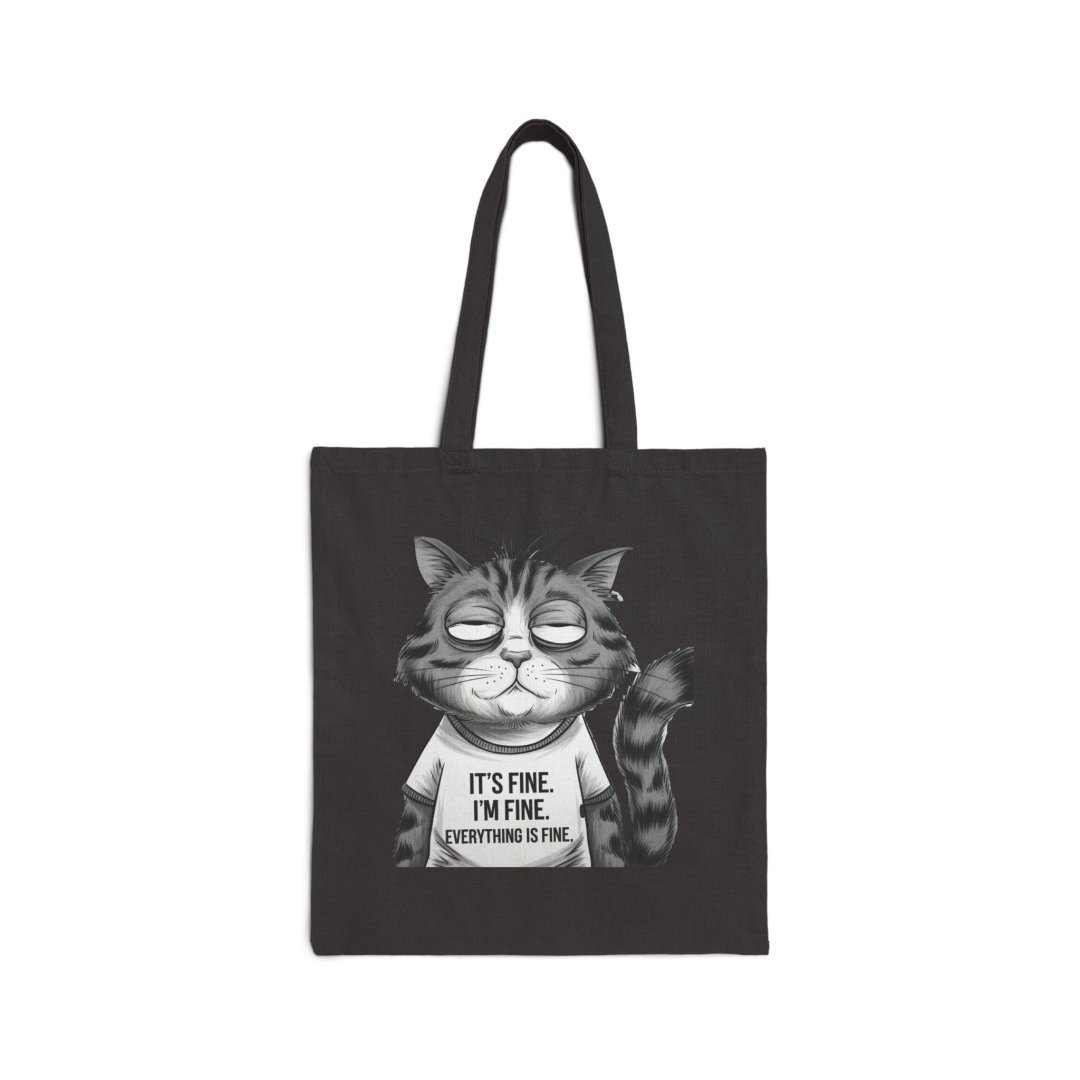 3388749684828680470_2048.jpeg Black tote bag with a cartoon cat wearing a shirt that says 'It's fine. I'm fine. Everything is fine.'