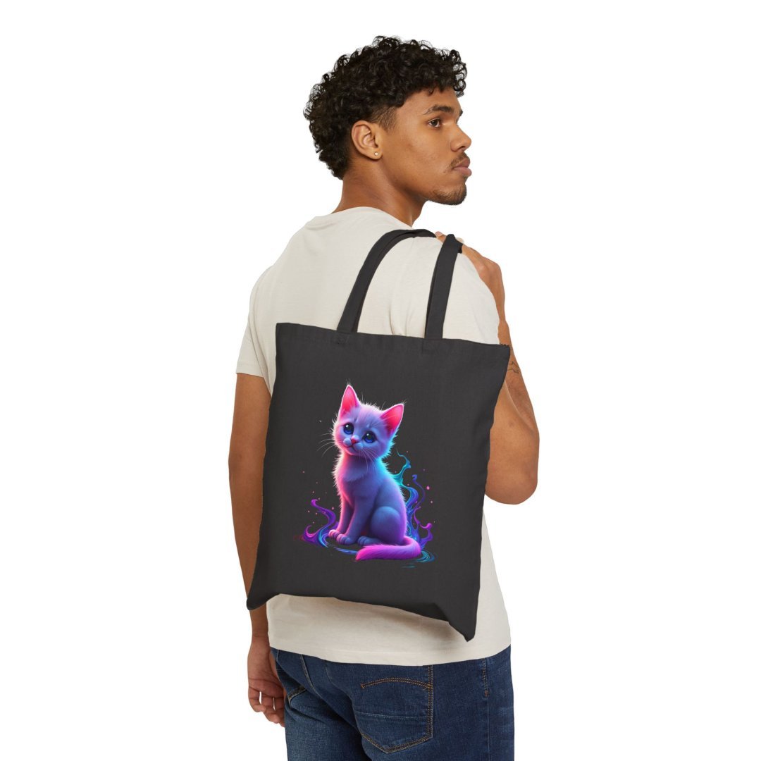 3401623401582241619_2048.jpeg Man carrying a black tote bag with a colorful cat design.