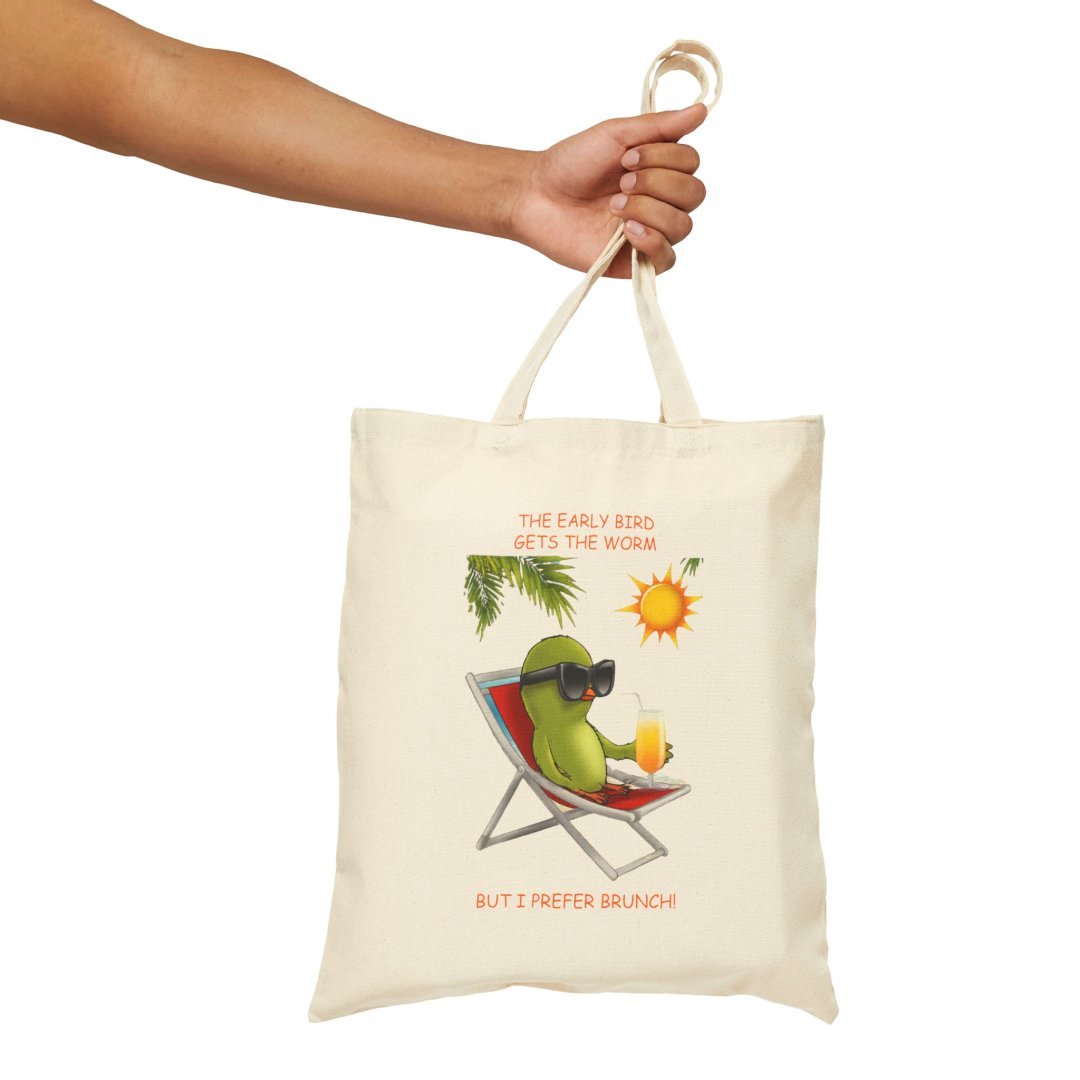 4073388618329766942_2048.jpeg Canvas tote bag with a bird lounging on a chair, wearing sunglasses.