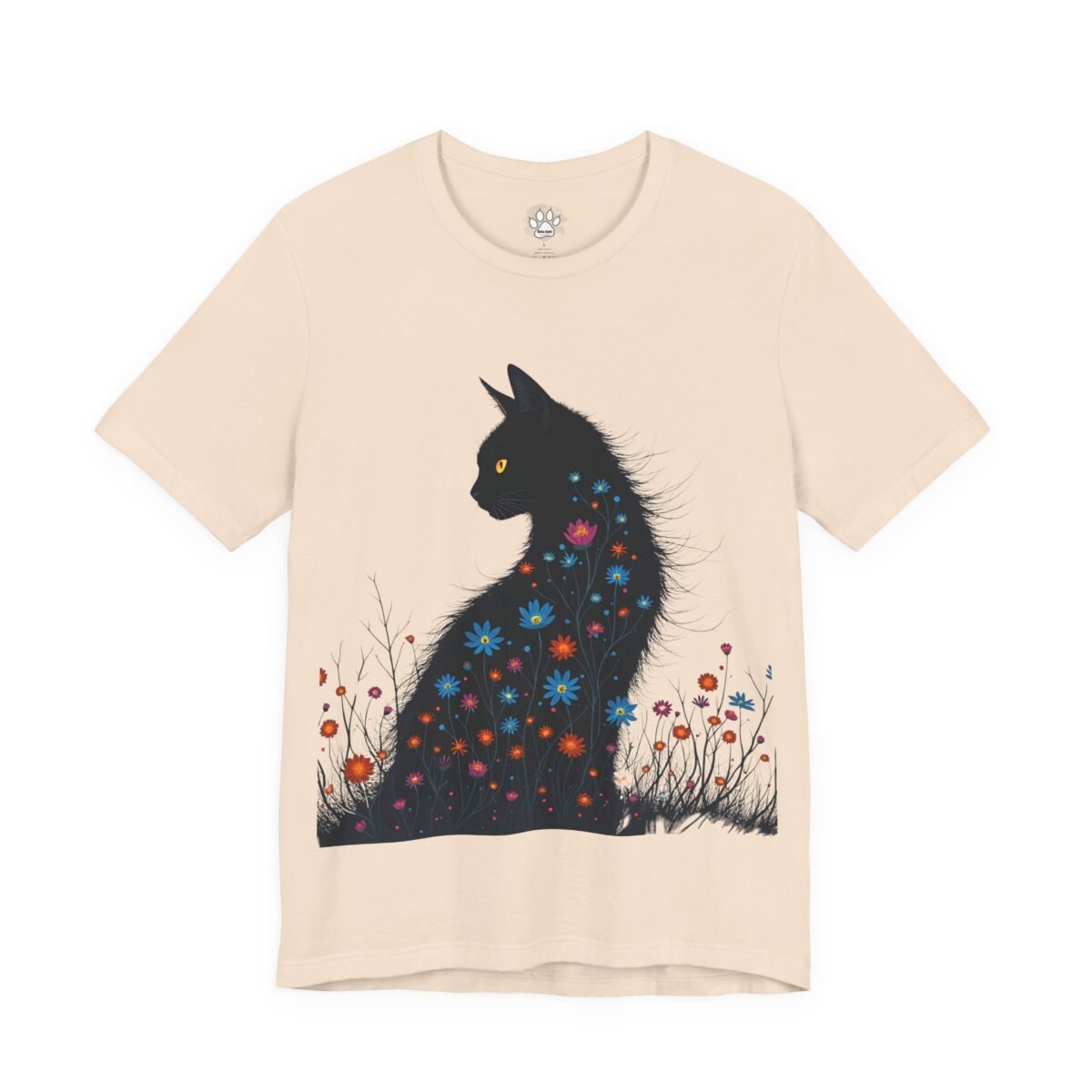 4712490789834518892_2048.jpeg Cream t-shirt with a black cat design featuring colorful flowers on its body.