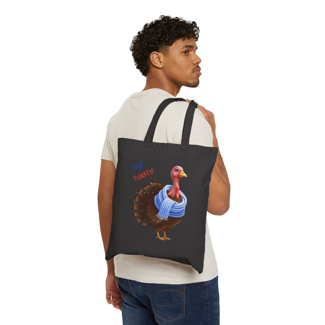 4764927687060260737_2048.jpeg Man carrying a black tote bag with a turkey wearing a scarf design.