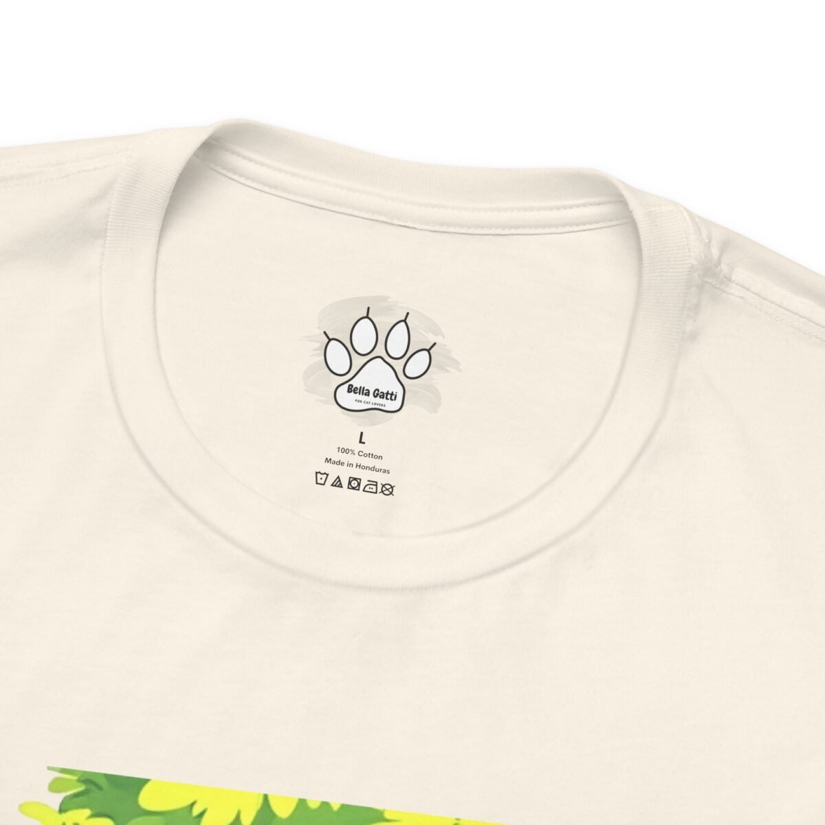 4907063466711843289_2048.jpeg An off-white t-shirt with an inner neck label featuring a paw print, "Bella Gatti", size L, 100% Cotton, and "Made in