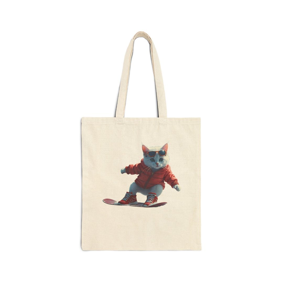 5790620967080025695_2048.jpeg Tote bag with a cat snowboarding in a red jacket and sunglasses.