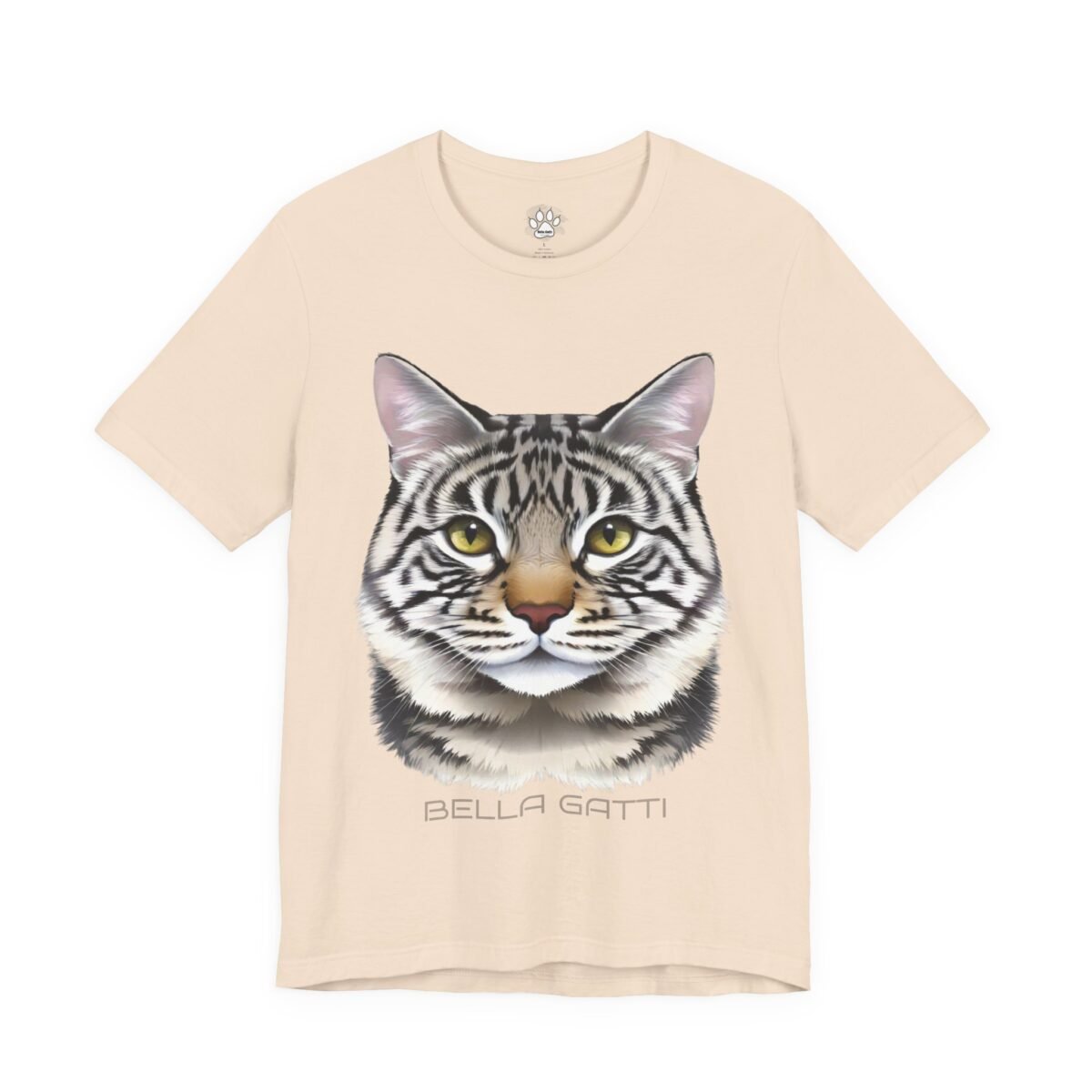 Bella Gatti Tabby Portrait T-shirt. Beige t-shirt with a detailed gray tabby cat face, yellow eyes, and "BELLA GATTI" text.