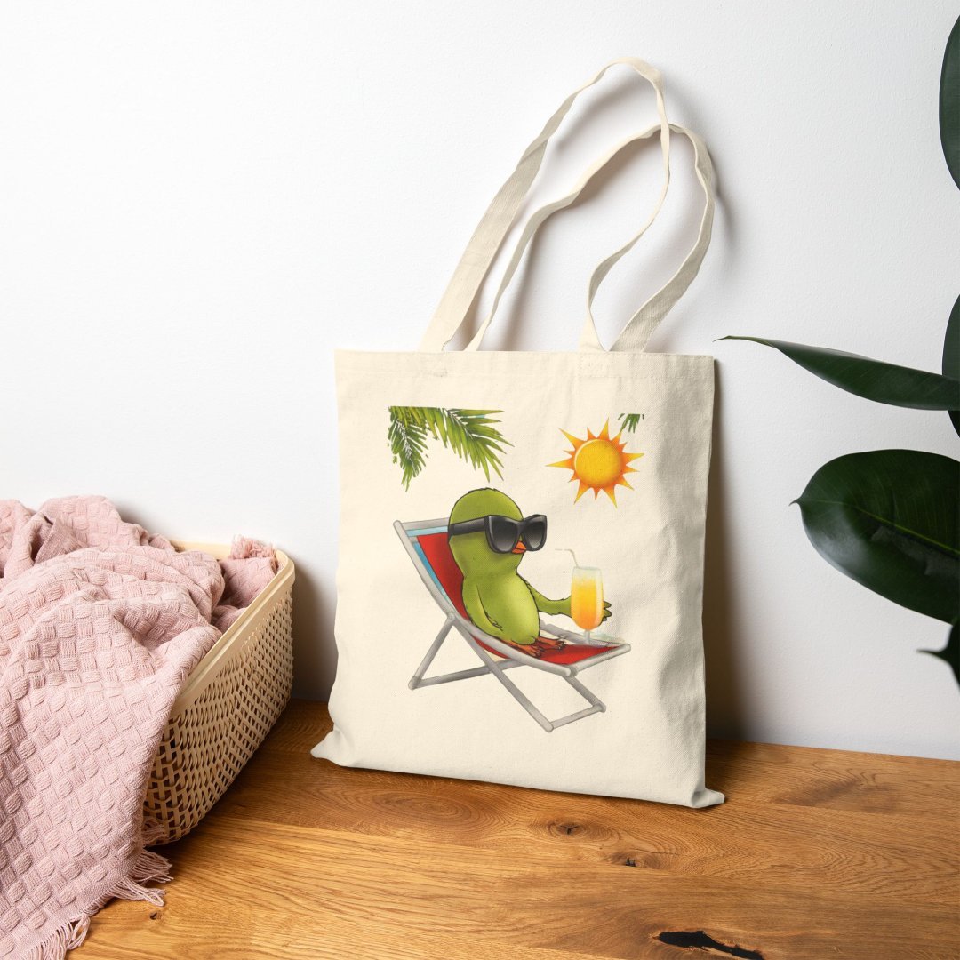 6537247249091693991_2048.jpeg Tote bag with cartoon bird lounging on a chair under the sun.