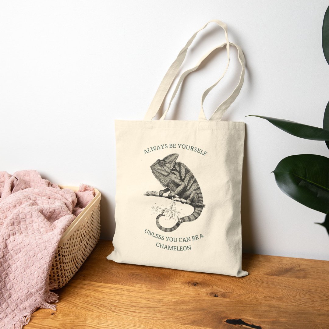 6930359071544837059_2048-1.jpeg Canvas tote bag with chameleon graphic and motivational quote.