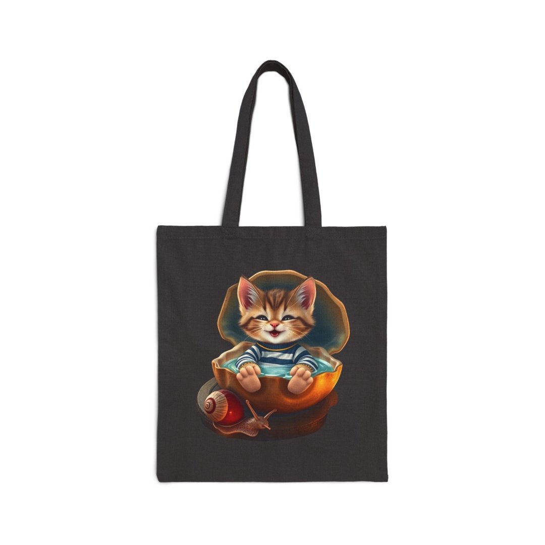 Cute Shell Kitten Cotton Canvas Tote Bag. Cute kitten in a striped shirt sitting in a shell on a black tote bag.