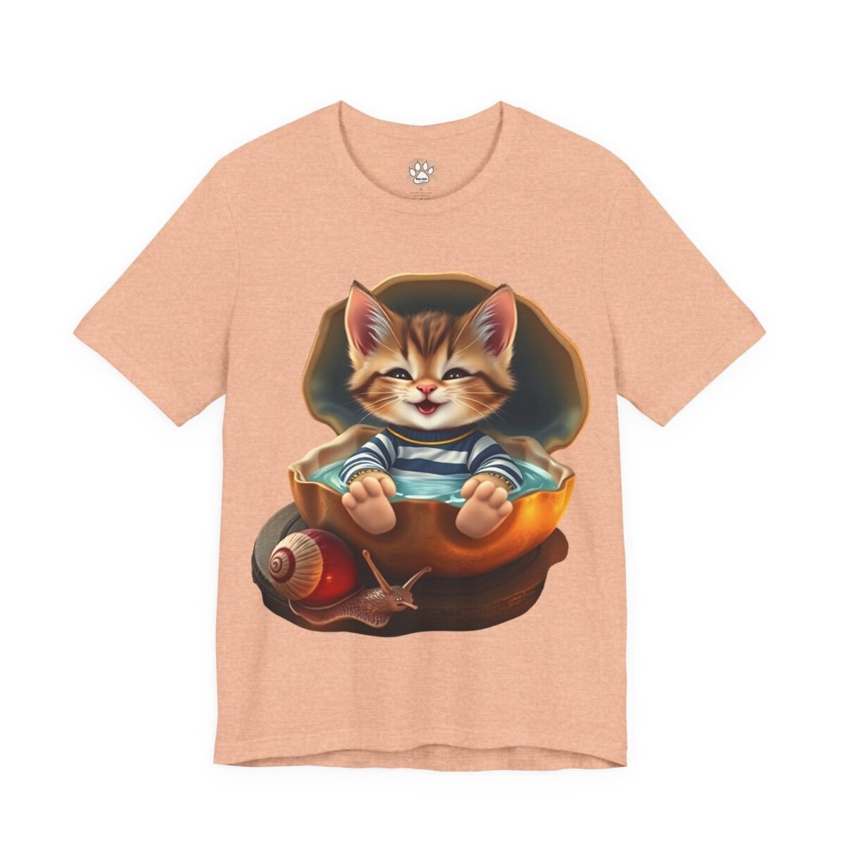 Peach t-shirt featuring a smiling kitten in a clam shell bath, next to a snail. Shellmates: Kitten & Snail Unisex Graphic T-Shirt