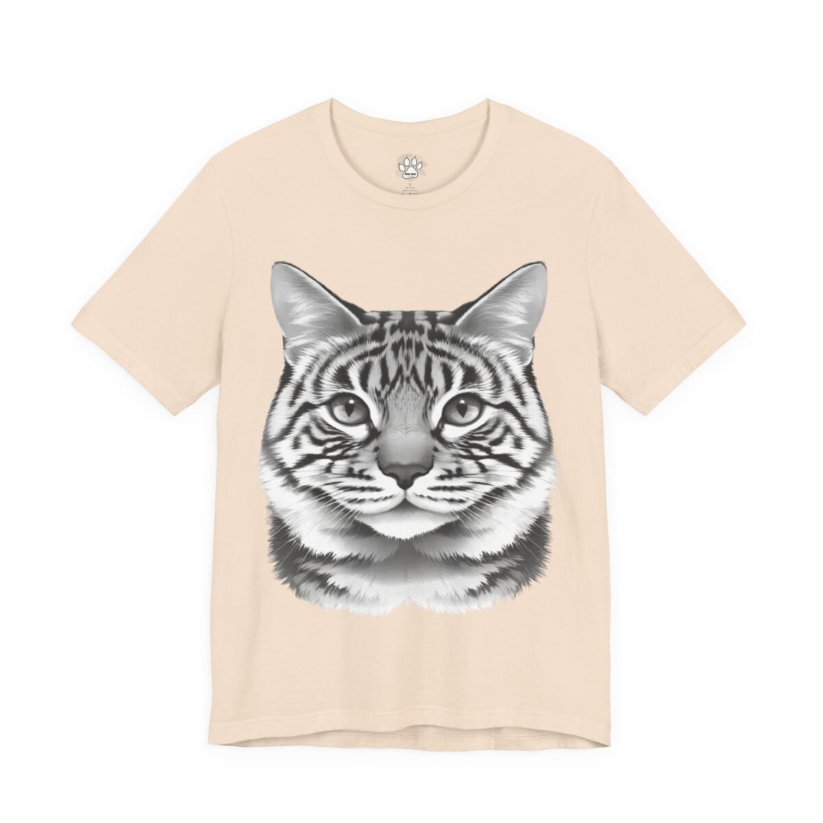 9662047689507110367_2048.jpeg Light peach t-shirt with a detailed striped cat face in grayscale.