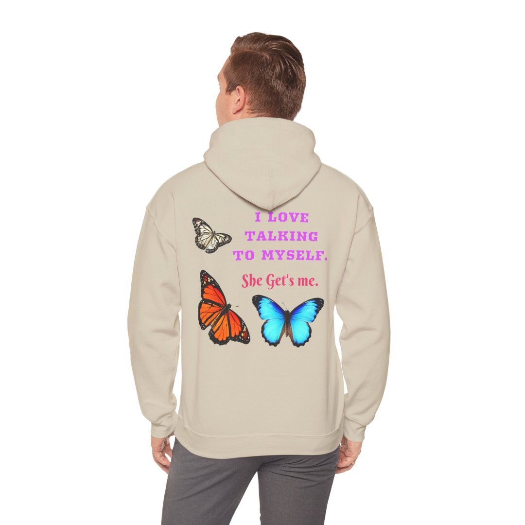 14545530924235639722_2048.jpeg Person wearing a hoodie with colorful butterflies and text on the back.