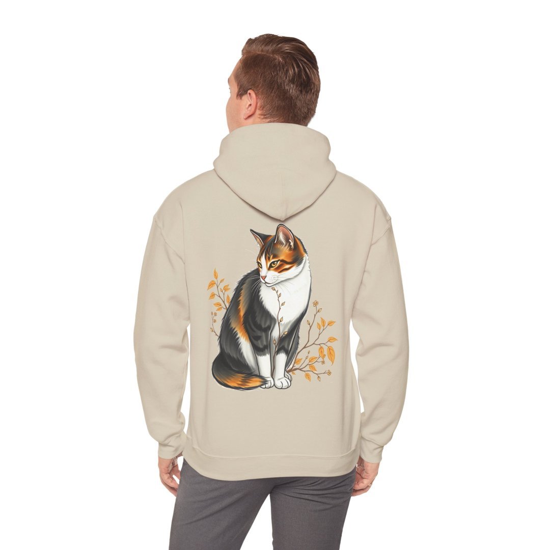 17688960497548089098_2048.jpeg Man wearing a beige hoodie with a cat illustration on the back.