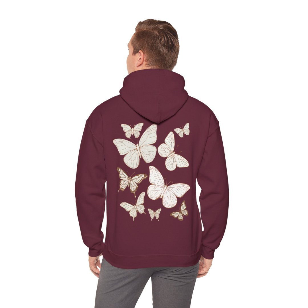 18218397086087820499_2048.jpeg Man wearing a maroon hoodie with white butterfly designs on the back.
