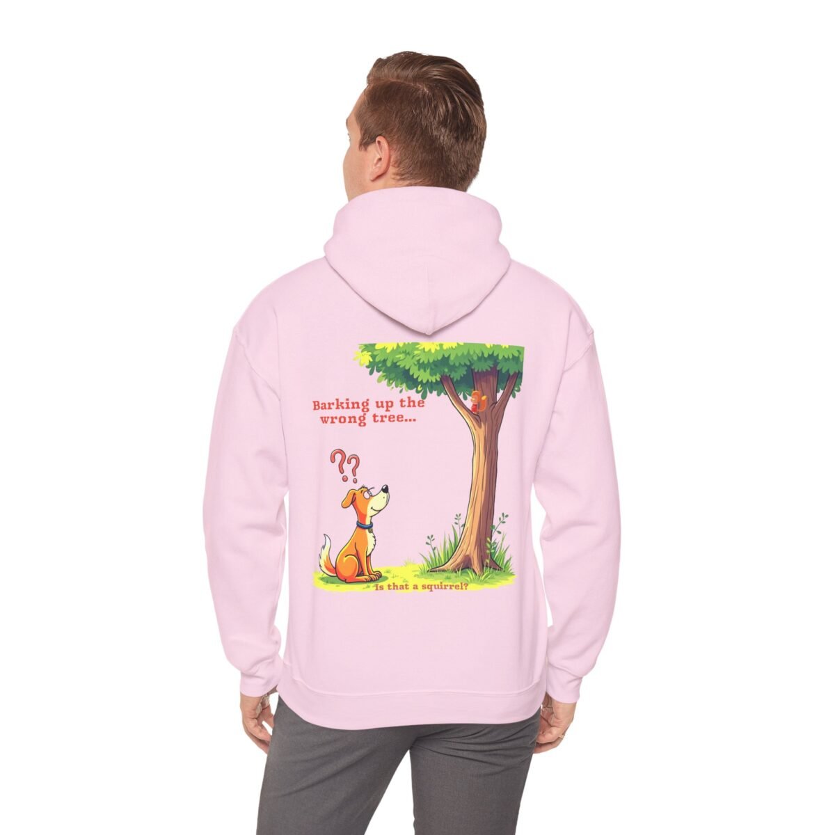 5782647756946886493_2048.jpeg Pink hoodie with a cartoon dog confused by a squirrel in a tree and the text "Barking up the wrong tree... Is that a