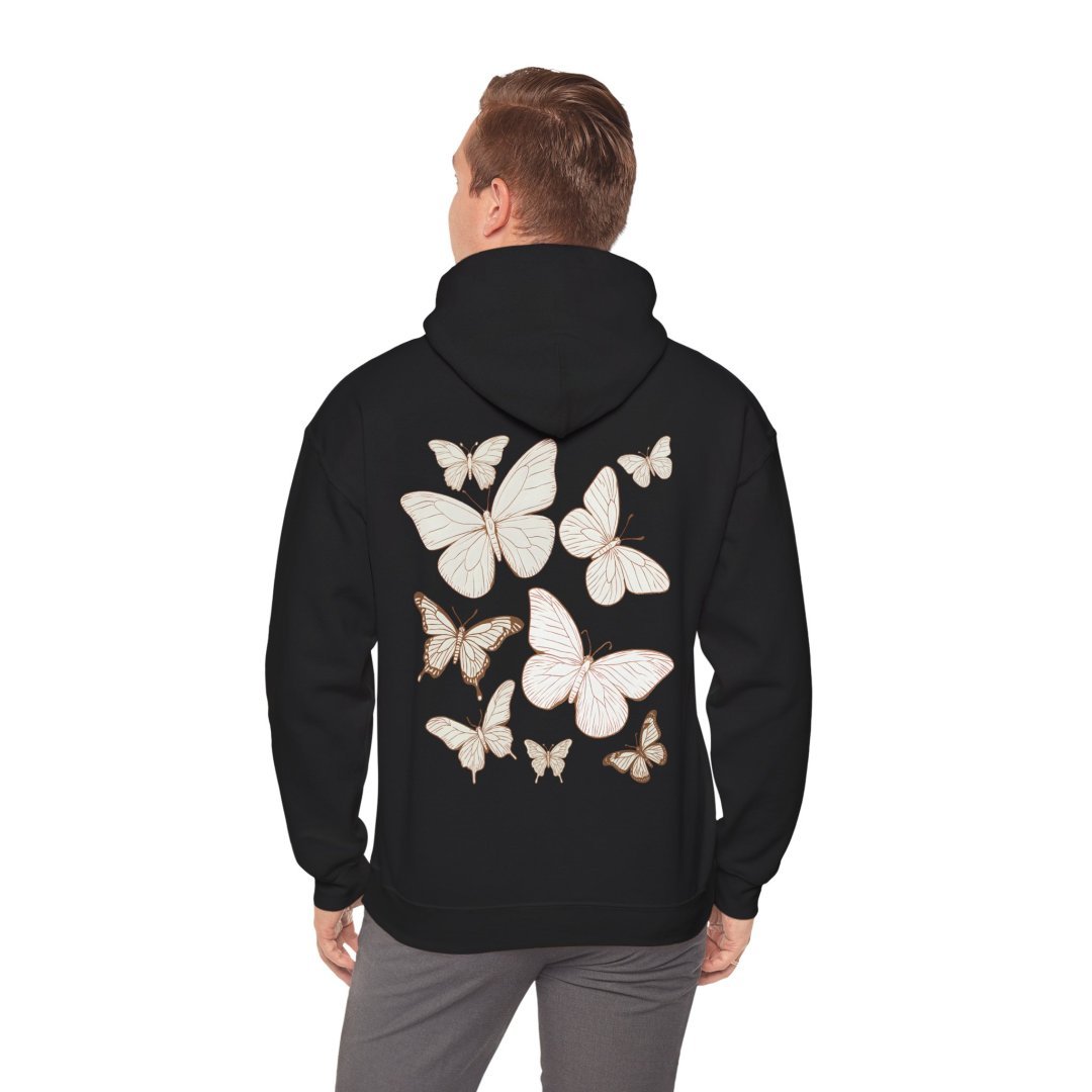 5885497509722048468_2048.jpeg Person wearing a black hoodie with butterfly designs on the back.